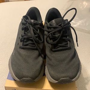 Slightly worn Black Nike revolutions.